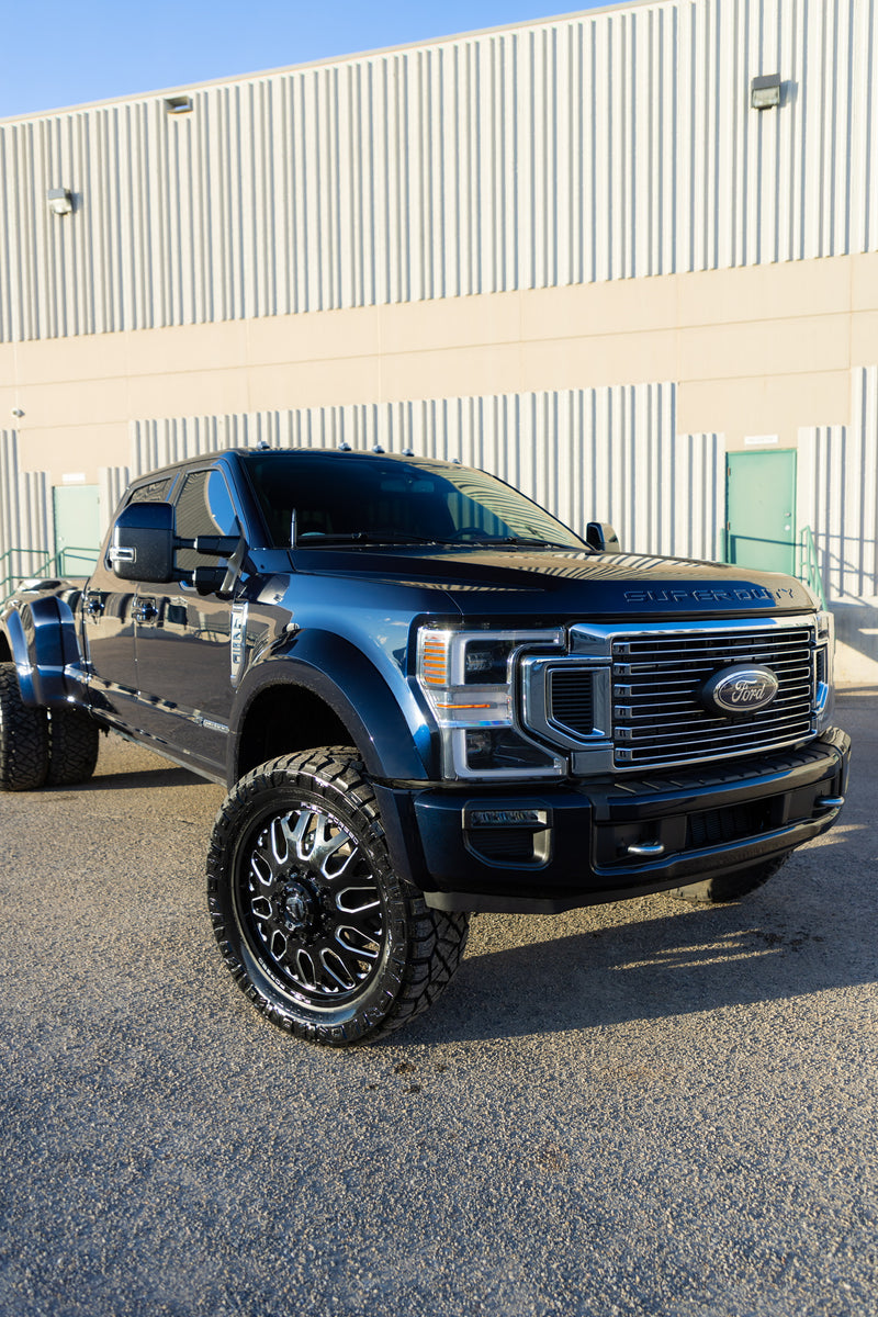 Ford Superduty dually truck with custom wheels showcasing premium vehicle wrap and paint protection film services by wraptors calgary