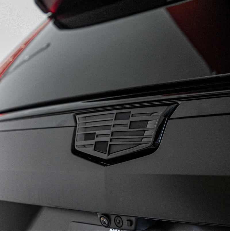 Cadillac rear emblem close-up on matte grey luxury vehicle with colour change paint protection film installed by wraptors calgary