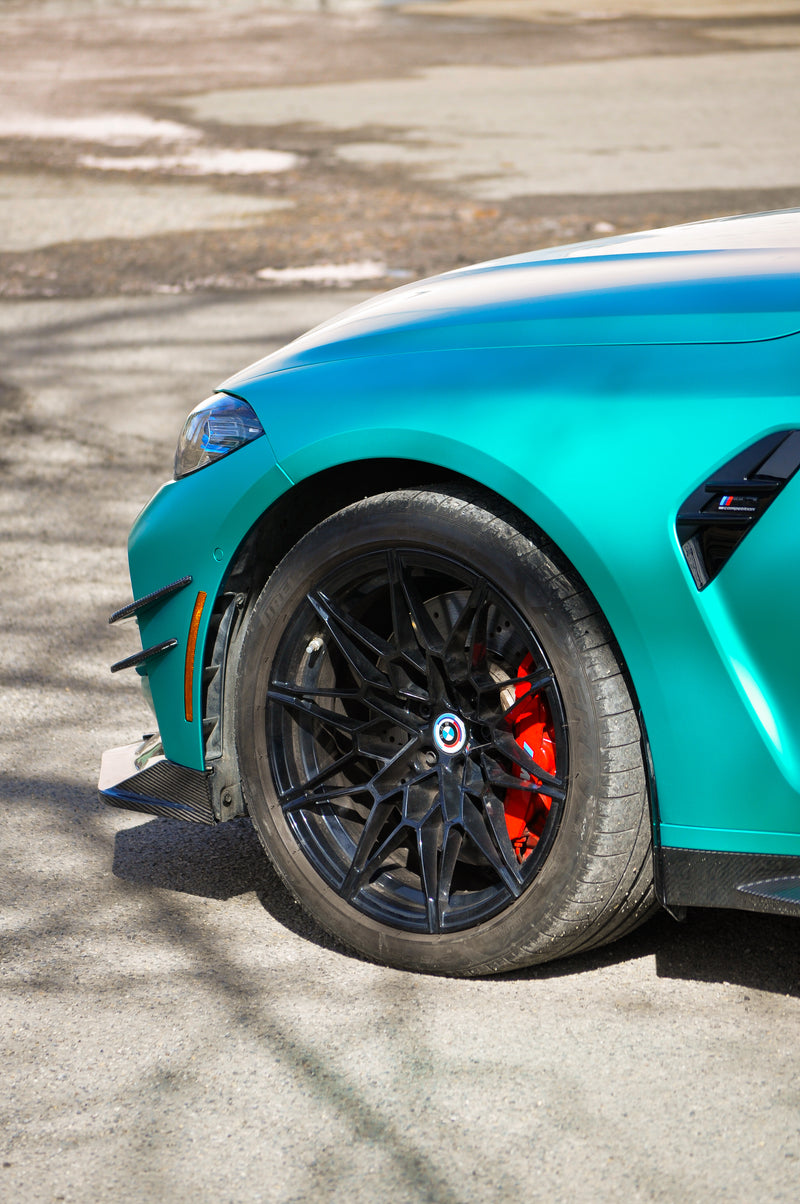 BMW M3 wheel and red brake caliper detail with emerald green coloured PPF wrap Calgary, custom car wraps Calgary build