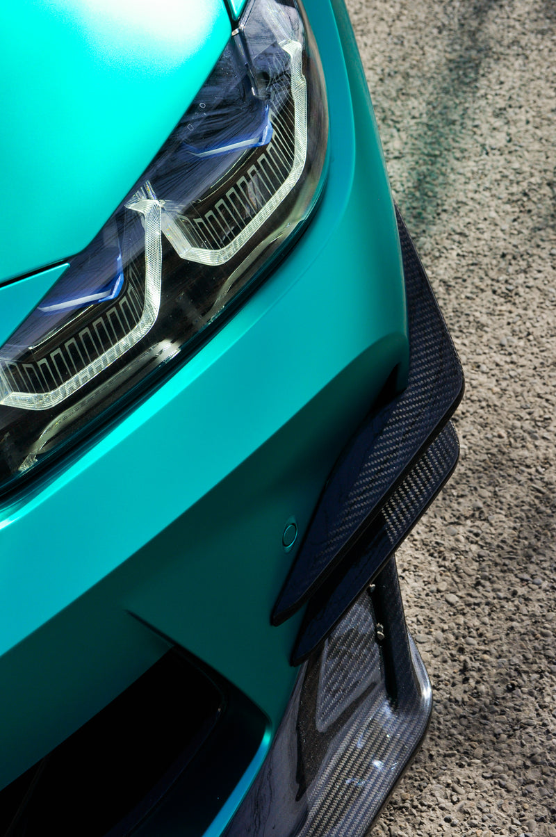 Close up front bumper BMW M3 with emerald green vinyl wrap Calgary, coloured PPF installation detail Wraptors Calgary