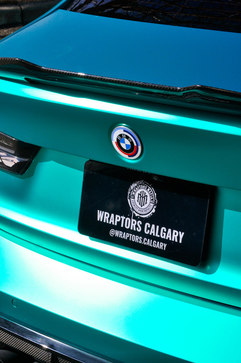 BMW M3 rear badge and trunk detail emerald green coloured PPF Calgary, custom vehicle wrap by Wraptors Calgary